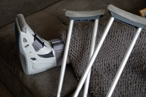Orthopedic walking boot and crutches