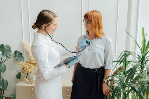 Doctor examining a patient with a stethoscope