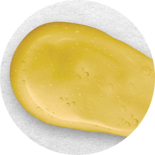 Close-up of the gel, greenish-yellow from its botanicals